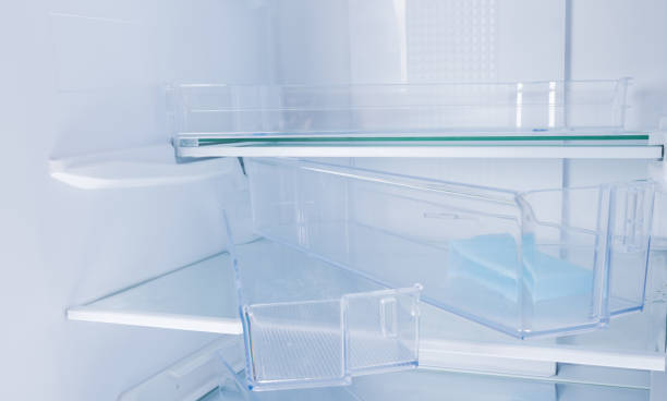 istock close-up of disassembled shelves and drawers, inside a white refrigerator 1356572499