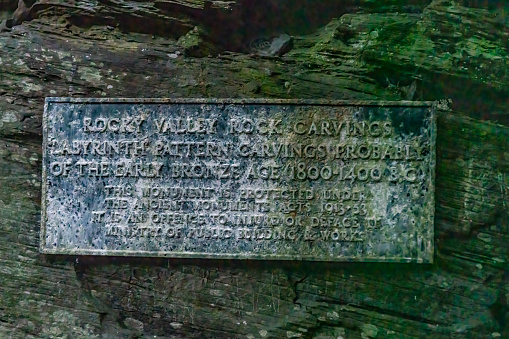 Bronze age carvings sign in Rocky Valley, Tintagel.  Rocky Valley, Tintagel, Cornwall, UK.
