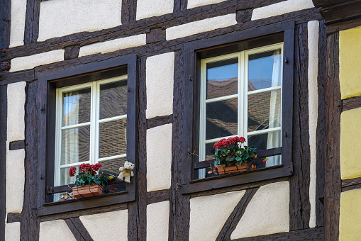 Alsace. Old ancient French city Colmar. Summer trip to France. European country. French architecture. Street. Facade of houses