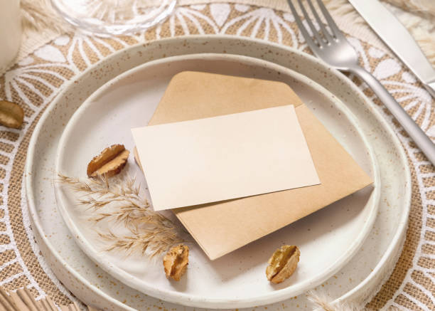 istock Wedding Table place with Blank paper card and envelope on bohemian placemat 1356573667