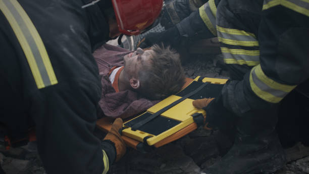 istock Emergency service workers saving injured teenager 1356574348