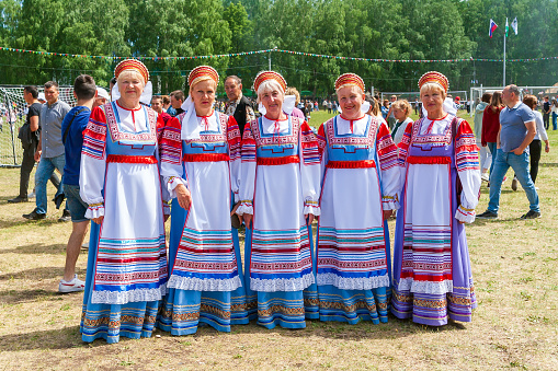 Ufa, Chishmy, Russia, 06.05.2021. National Tatar-Bashkir holiday Sabantuy. Older women in Russian national dress.
