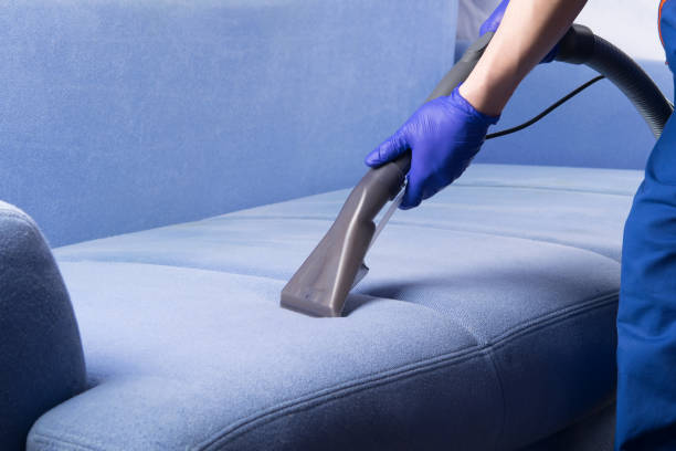 specialist in protective gloves, cleans the fabric of the sofa with a washing vacuum cleaner and foam - domestic car color image horizontal car imagens e fotografias de stock