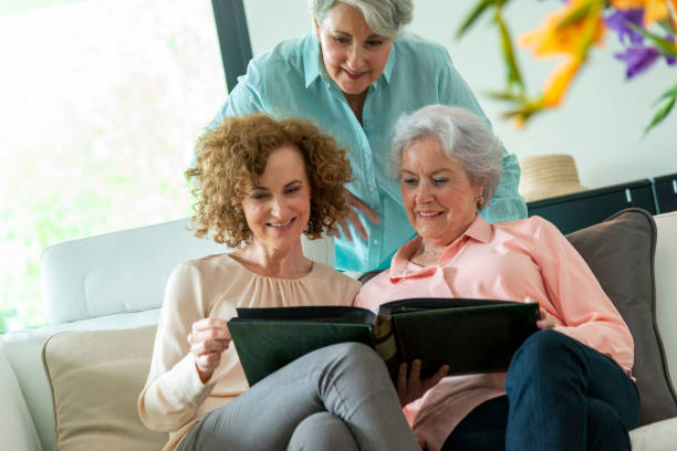 istock Mother and two mature daughters interaction 1356575833