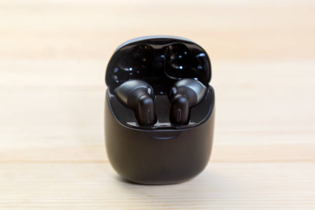 istock Wireless headphones are charged in a container box 1356577004