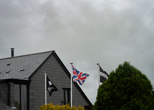 Ikurrina flag, a Basque symbol and the official flag of the Basque Country Autonomous Community of Spain and France, waving in front of a house in Arcachon