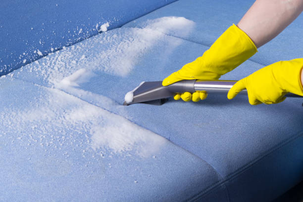 specialist in protective gloves, cleans the dirty sofa surface with a washing vacuum cleaner and foam, close-up - domestic car color image horizontal car imagens e fotografias de stock