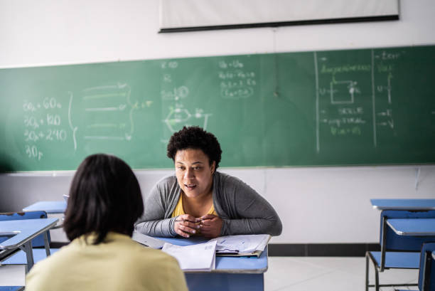 istock Student studying with a teacher in the classroom 1356577906