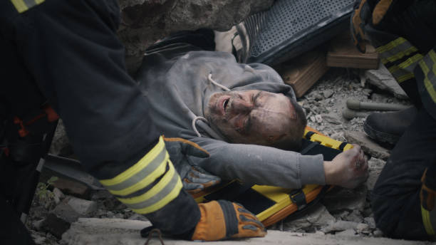 istock Injured senior man speaking with rescuers 1356578547