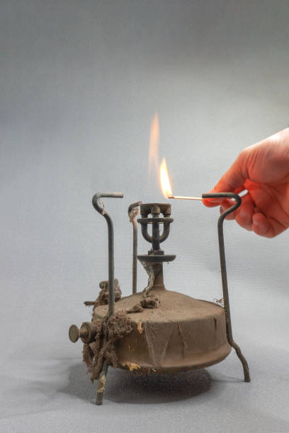 istock an old kerosene primus in dust and cobwebs with a burning fire 1356578826
