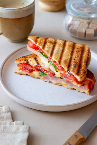 istock Sandwich with ham, tomato, cheese and spinach. Breakfast. Fast food. 1356581245