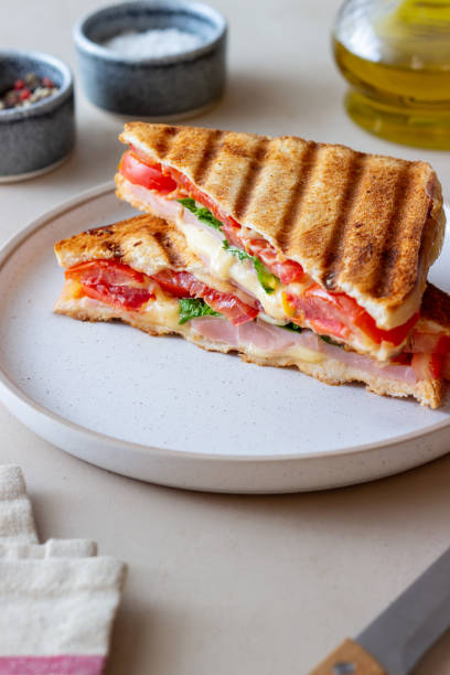 istock Sandwich with ham, tomato, cheese and spinach. Breakfast. Fast food. 1356581400