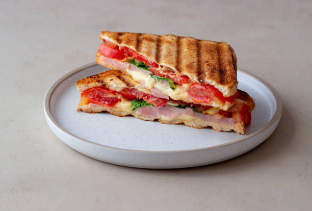 Sandwich with ham, tomato, cheese and spinach. Breakfast. Fast food.