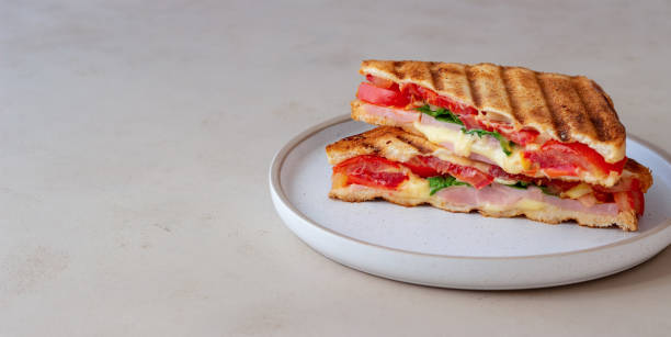 istock Sandwich with ham, tomato, cheese and spinach. Breakfast. Fast food. 1356581452