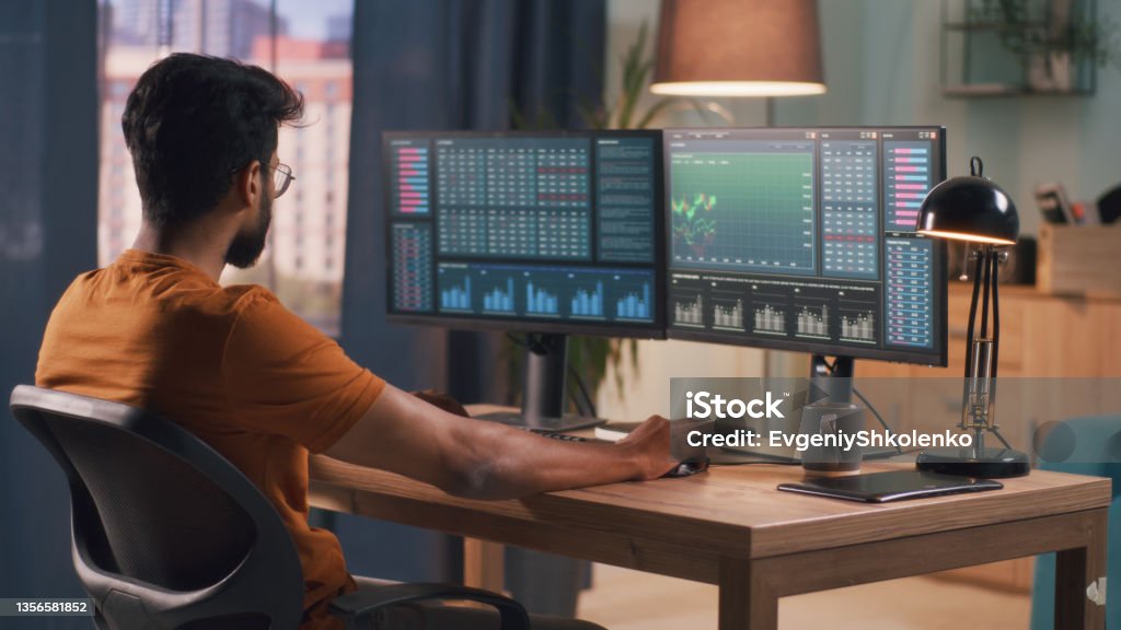 Trading Man With Computer Indian Man Analyzing Stock Graphs On Computer Stock Photo - Download ...