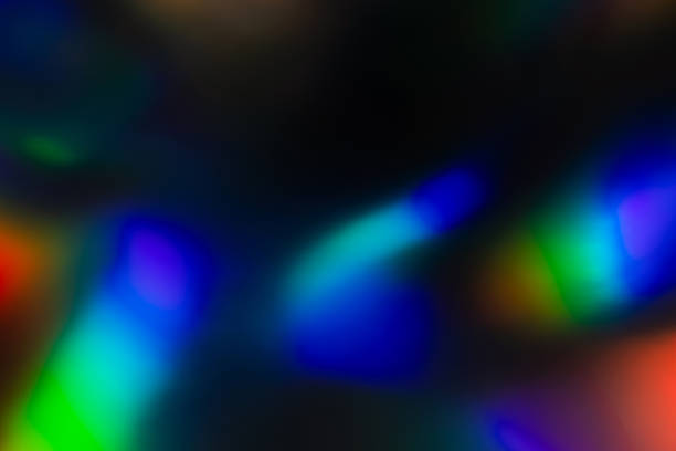 istock colorful rainbow crystal light leaks on black background 1356582092