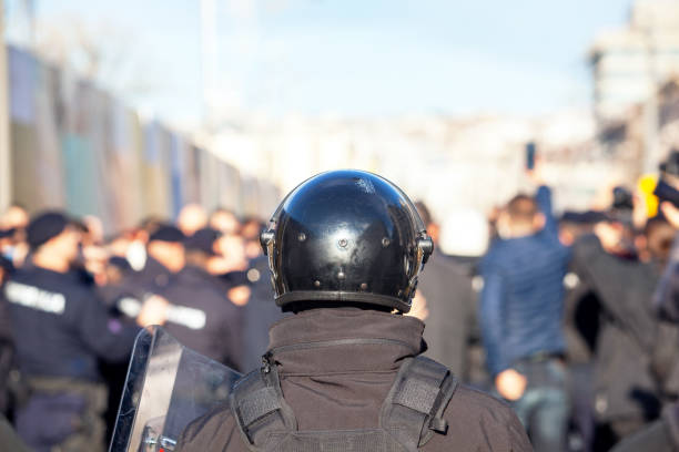 istock Riot police on duty during crowd protest or demonstration 1356582955