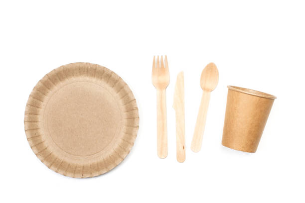 istock Disposable cup, plate and wooden cutlery on a white background 1356584931