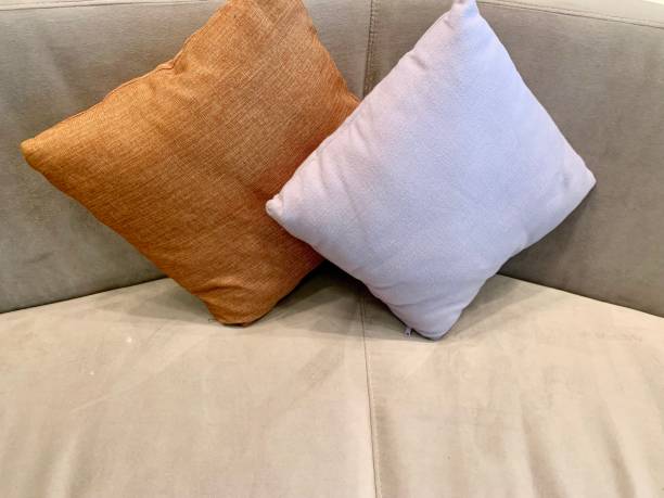 istock White and brown pillow on the couch 1356584985