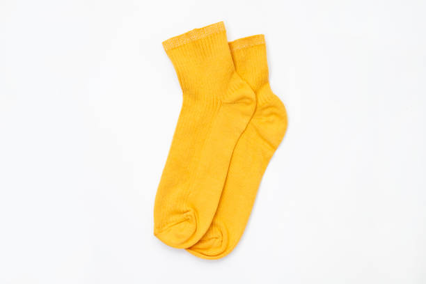 istock Yellow socks on an isolated white background 1356585006