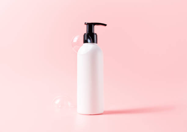 istock Bottle with soapy bubbles. Beauty skincare cosmetic packaging mockup 1356587415