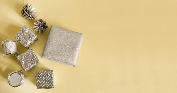 istock Gift silver boxes on a light table. colorful box of gifts. 1356590536