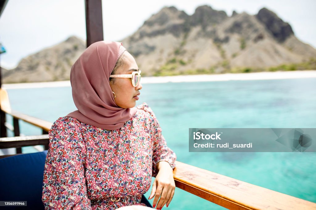 sadness muslim woman taking adventure in komodo island Indonesia Stock Photo