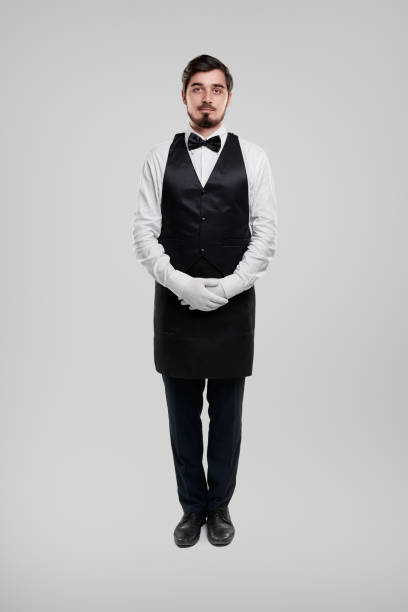 istock Restaurant staff in classic uniform looking at camera 1356594784