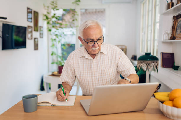 istock Senior businessman making a business plan at his home office 1356599196