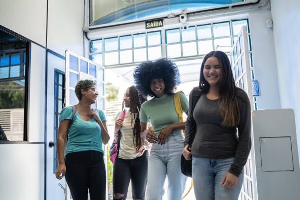 istock Teenage students talking at arriving at school 1356599265