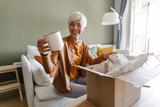 istock Package delivery and unpacking of ordered items at home 1356600035