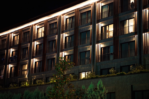 Hotel exterior at night, building exterior, modern luxury