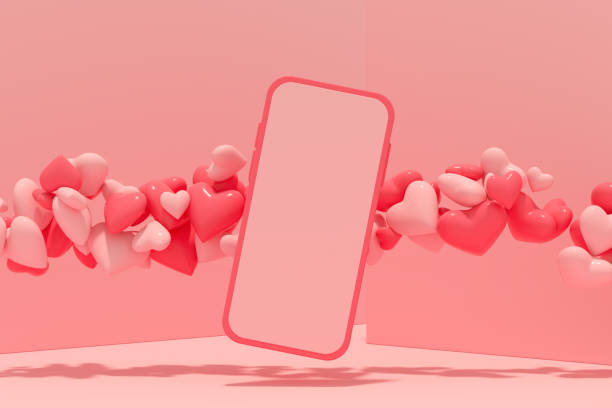 istock Valentine's Day blank screen smart mobile phone with flying hearts on Pink Background 1356601169