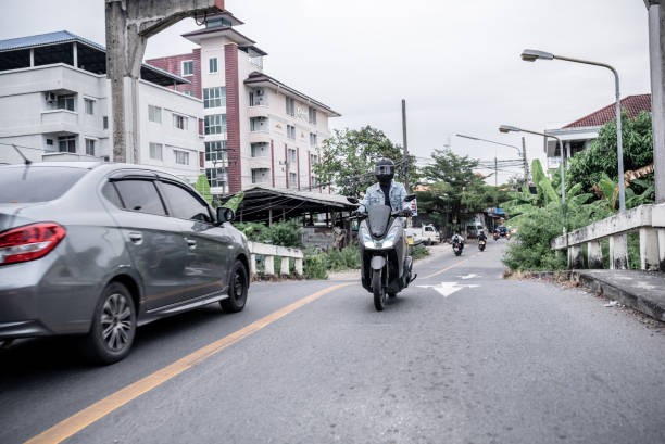 istock Young asian riding a motorcycle 1356601179