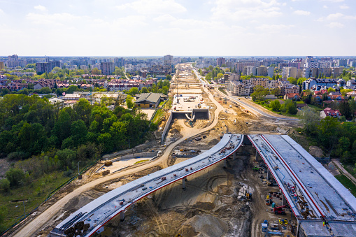 construction of new road at suburb area. aerial top view on indu in Warsaw, Masovian Voivodeship, Poland