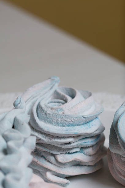 istock Marshmallow blue and pink. Decorated with mastic snowflakes. Close-up shot. 1356605827