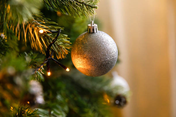 istock Classic Christmas decorated New year tree. Christmas tree with wite and silver decorations, ornaments toy and ball. Modern classical style interior design apartment. Christmas eve at home 1356609940