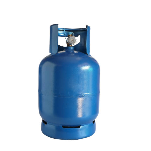 istock Old blue gas tanks isolated on white background. 1356610097
