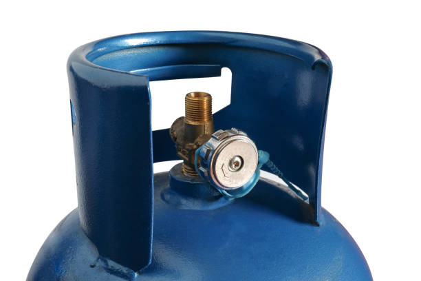 istock Old blue gas tanks isolated on white background. 1356610125