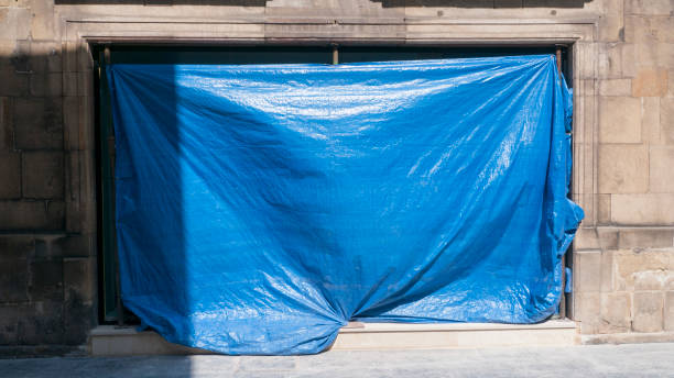 istock Blue plastic canvas hanging on door 1356611499
