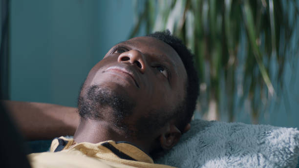 istock Thoughtful African American man on couch 1356612085