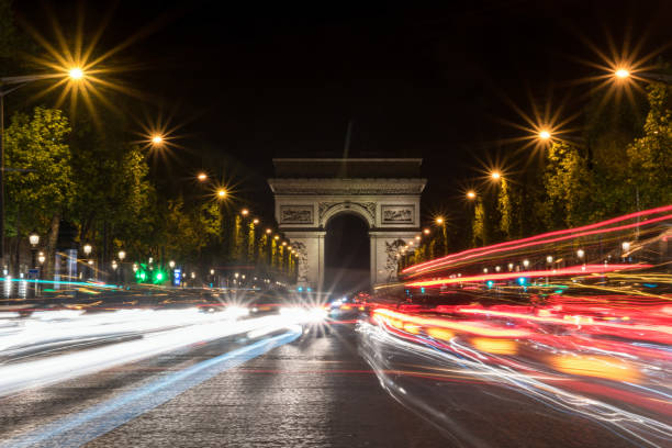 istock Nightly traffic on the Champs-Elysees, Arc de Triomph in the background 1356612808