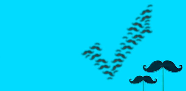 istock Prostate cancer symbol. Black mustache on a blue background. 1356614525