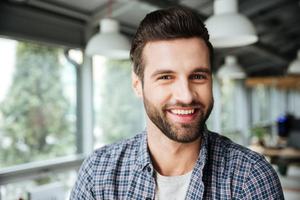 istock Happy man standing in office coworking 1356619061