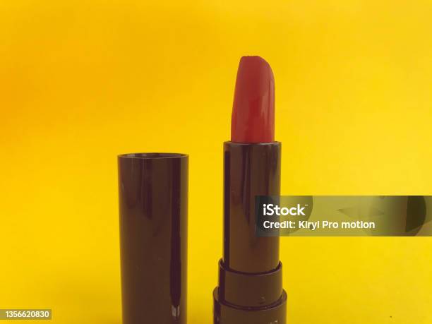Lipstick In A Black Compact Package On A Yellow Matte Background Bright Red Lipstick Shade Creation Lip Hydration Stylish And Trendy Shade Stock Photo - Download Image Now