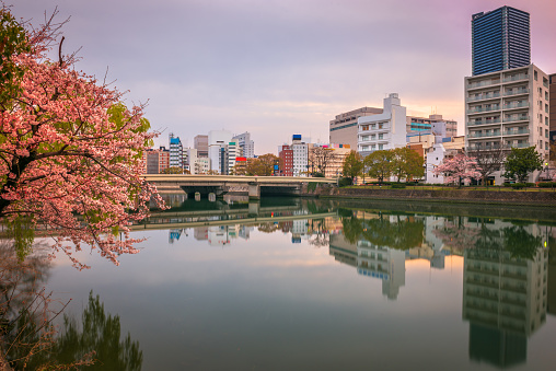 Hiroshima, Japan downtown cityscape on the Enko River at dawn.