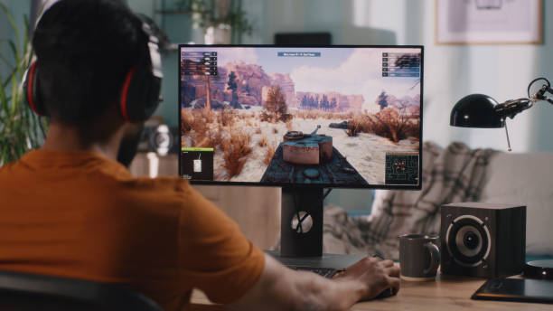 istock Male gamer playing tank videogame 1356623041