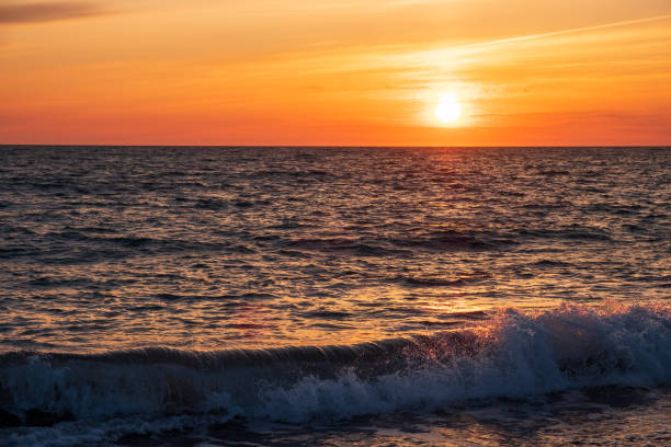 istock waves on the sea, the sky during sunset. smeared clouds evening sky 1356625756