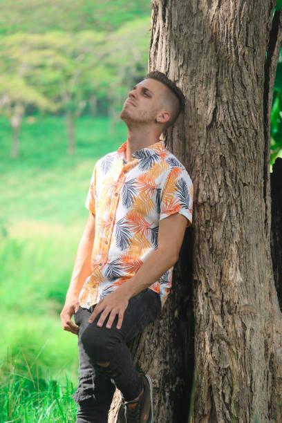 istock A depressed and worried young man in the forest 1356626956