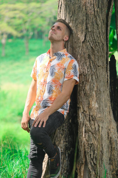 istock A depressed and worried young man in the forest 1356626996